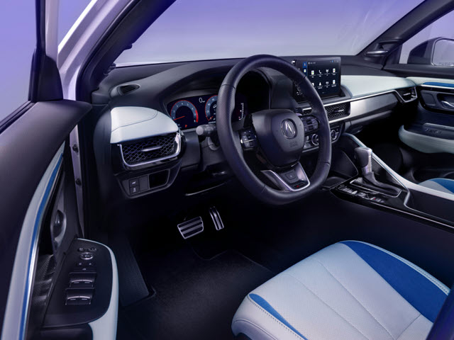 Modern 2025 Acura ADX interior with a steering wheel, dashboard display, and stylish seats in blue and white.